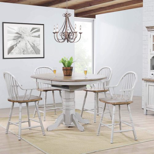 Country Grove Collection - Round pedestal pub table in distressed gray with Oak top and four Windsor bar height stools with arms in dining room setting DLU-CG4260CB30AGO5